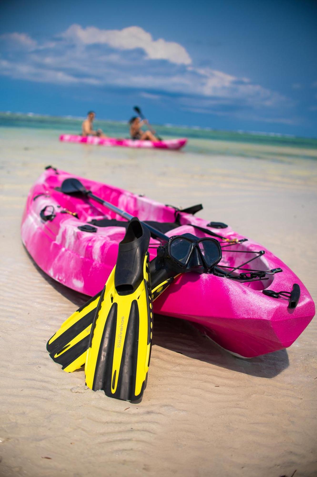 Diamonds Leisure Beach & Golf Resort Диани Бийч Екстериор снимка A sit-on-top kayak with a pair of flippers